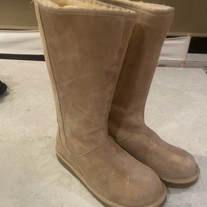 Never worn UGG boots. Zipper on back of boot. Size 10